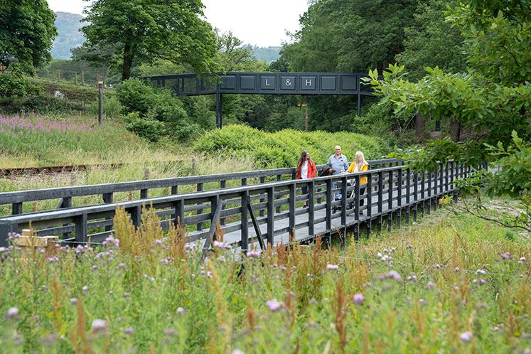 Walkers crossing over bridge on the Western Trail
